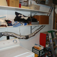 Before: The use of flexible, flammable material for the vent line creates a fire hazard.
